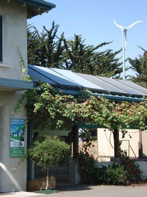 Residential-scale installation. small turbine on house roof