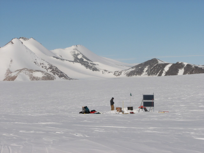 Penn State scientists installing a seismometer in Antarctica to measure earthquakes