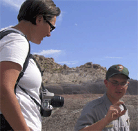 Man holding a petrified crocodilian tooth.