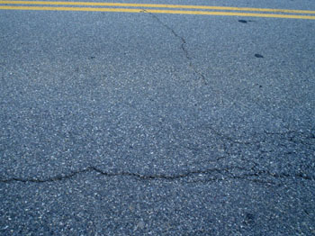  Road with cracks in it. See description below image