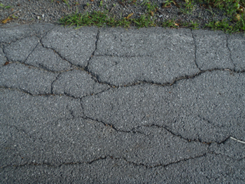 cracks in blacktop. See description below image